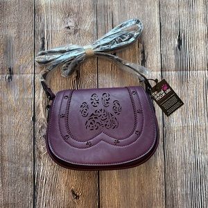 Brand new paw print purse in plum
